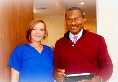 Dr. Okey Okoli with a member of his staff